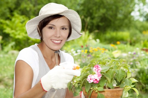 Worker using protective equipment during landscaping task